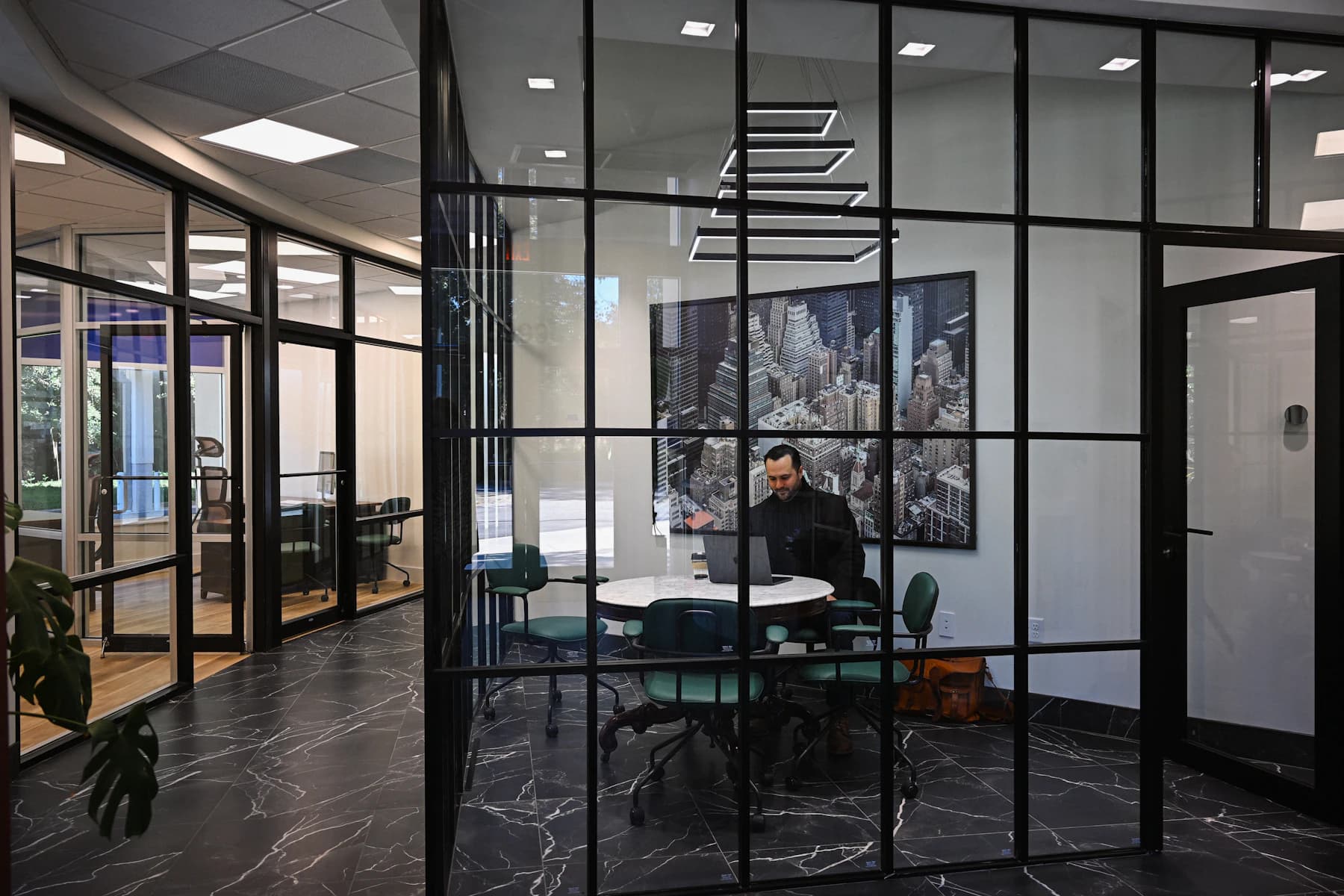 Business professional using technology in a modern workspace, shown as illustrative consulting imagery